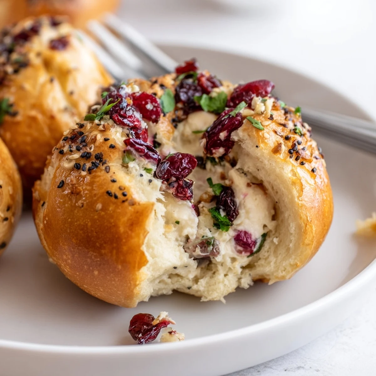 Warm and savory cranberry jalapeño bagel bombs, ideal for holiday gatherings and snacks.