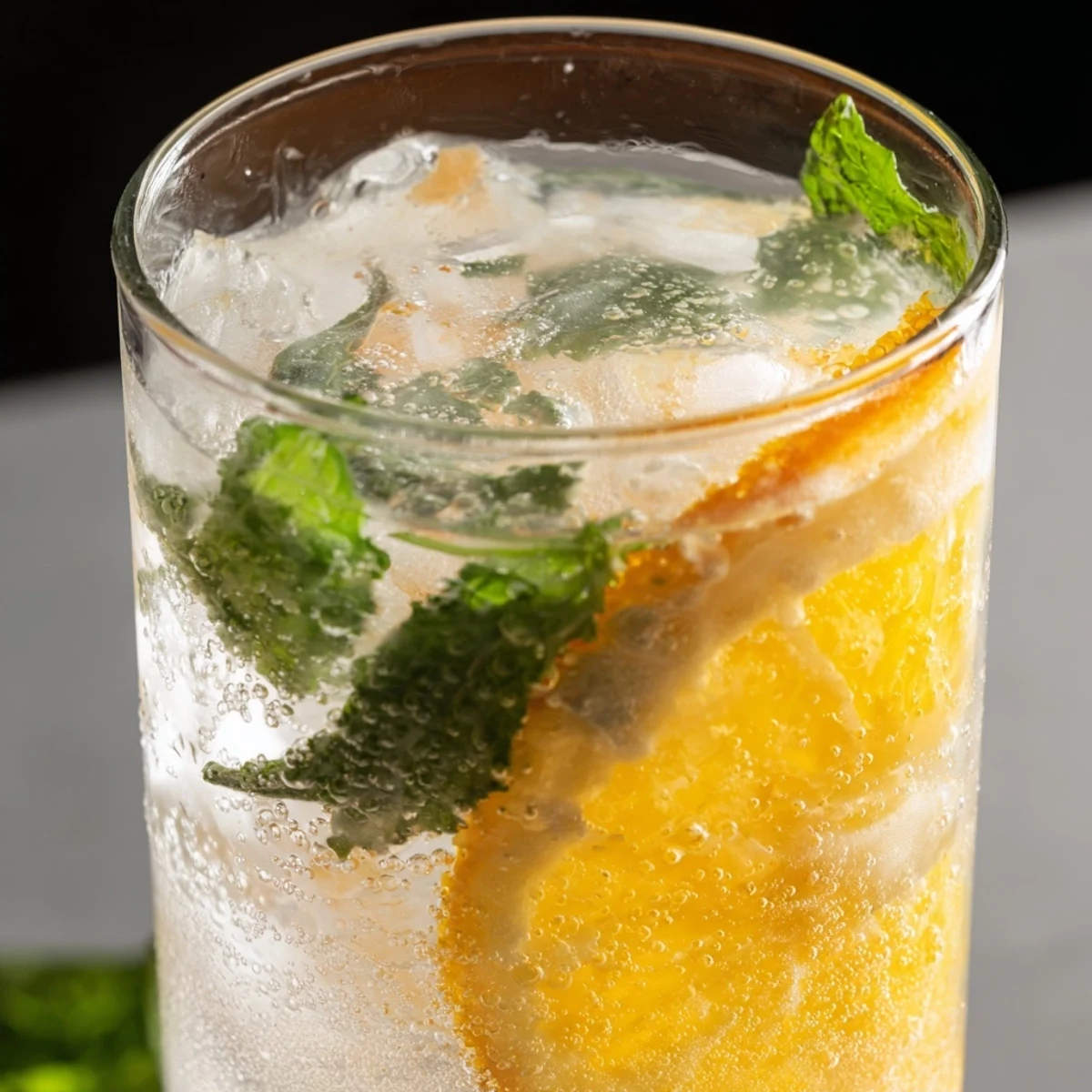 Refreshing probiotic soda mocktail served over ice, bursting with citrusy flavors and fizz.