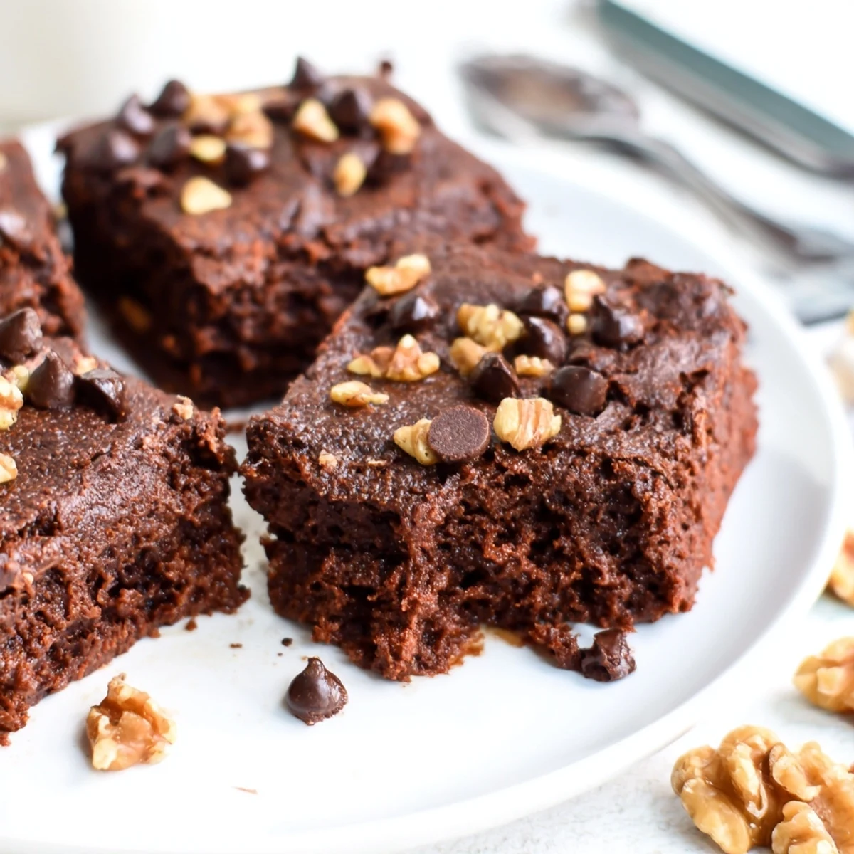 Delicious Zero-Waste Brownies baked with nut-milk pulp, melted chocolate, and nuts, enjoy warm.  