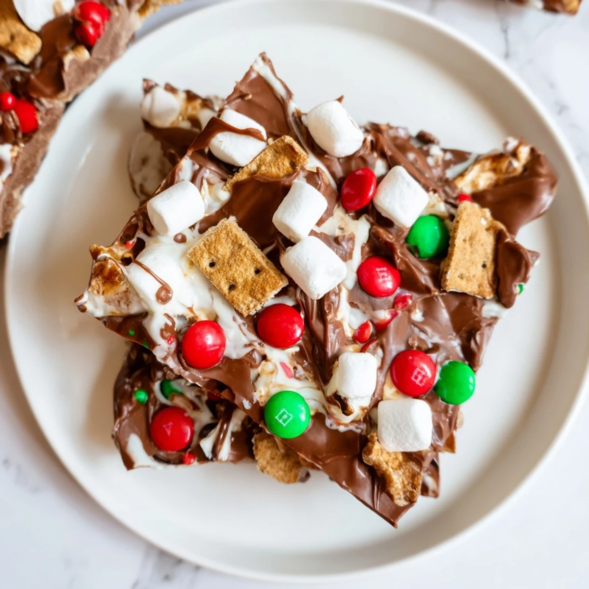 This delightful festive Quick Christmas Smores Bark shows graham crackers, chocolate and candy in an eye-catching array.