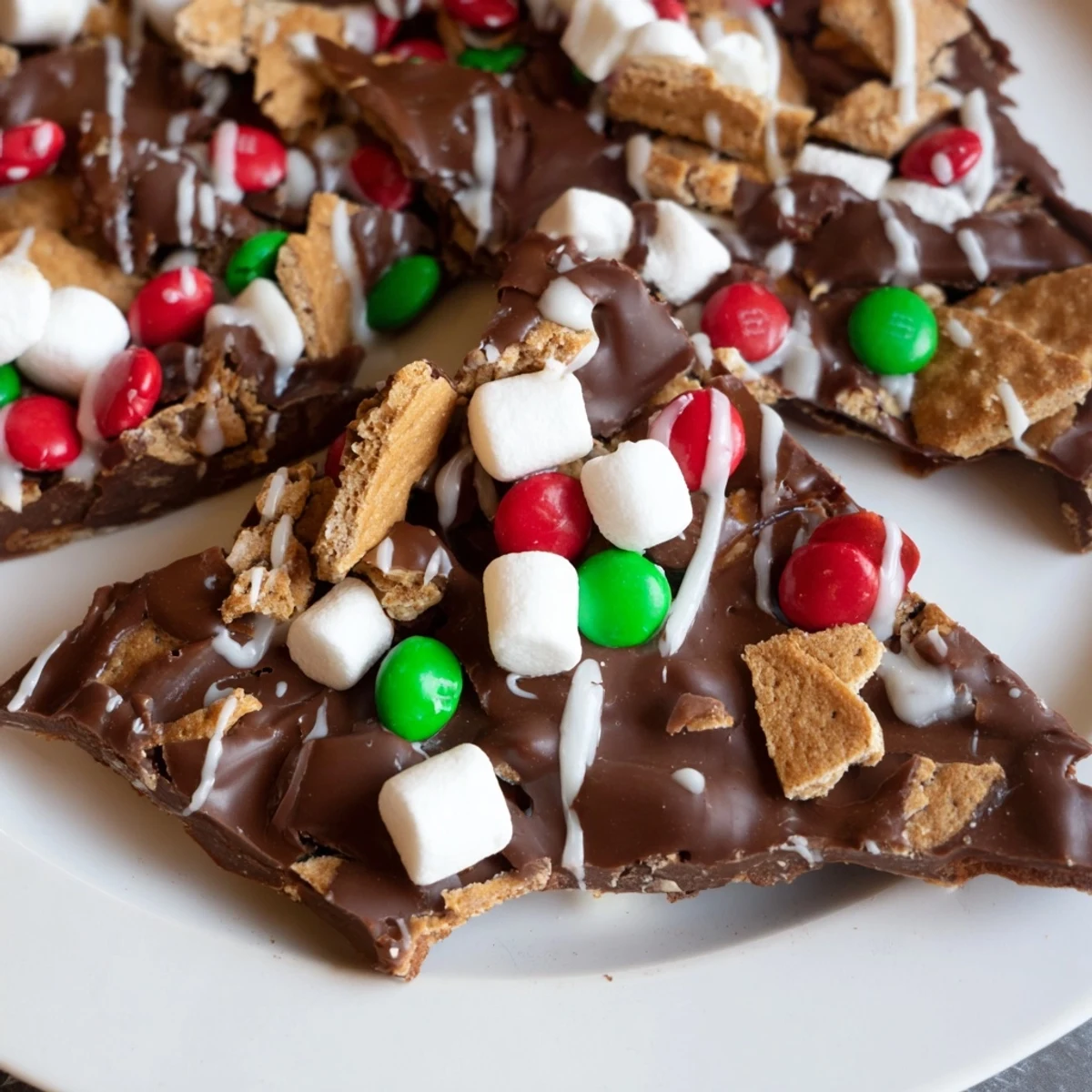 See layers of chocolate and toppings on this Quick Christmas Smores Bark, a delicious holiday dessert idea.