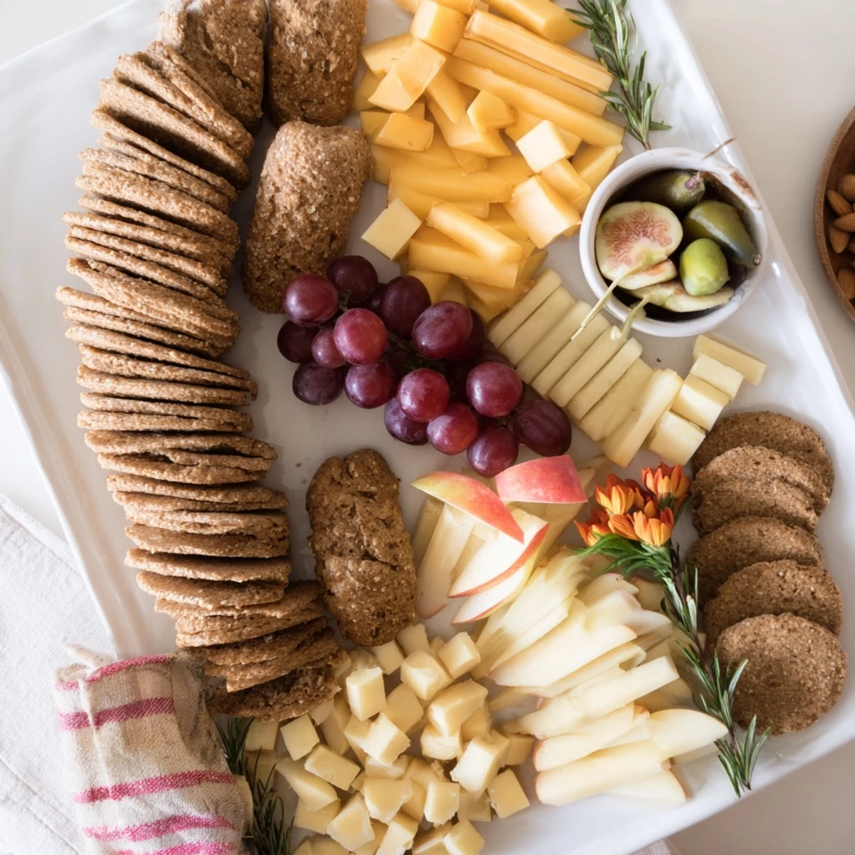 A beautiful Golden Wheat Bundle Board, overflowing with vibrant fruits and assorted cheeses for sharing.