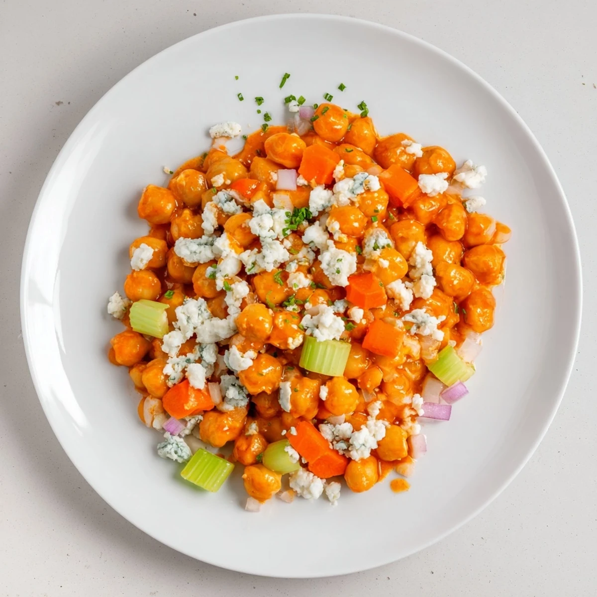 Vibrant buffalo chicken bean salad with creamy blue cheese, perfect for a quick lunch.