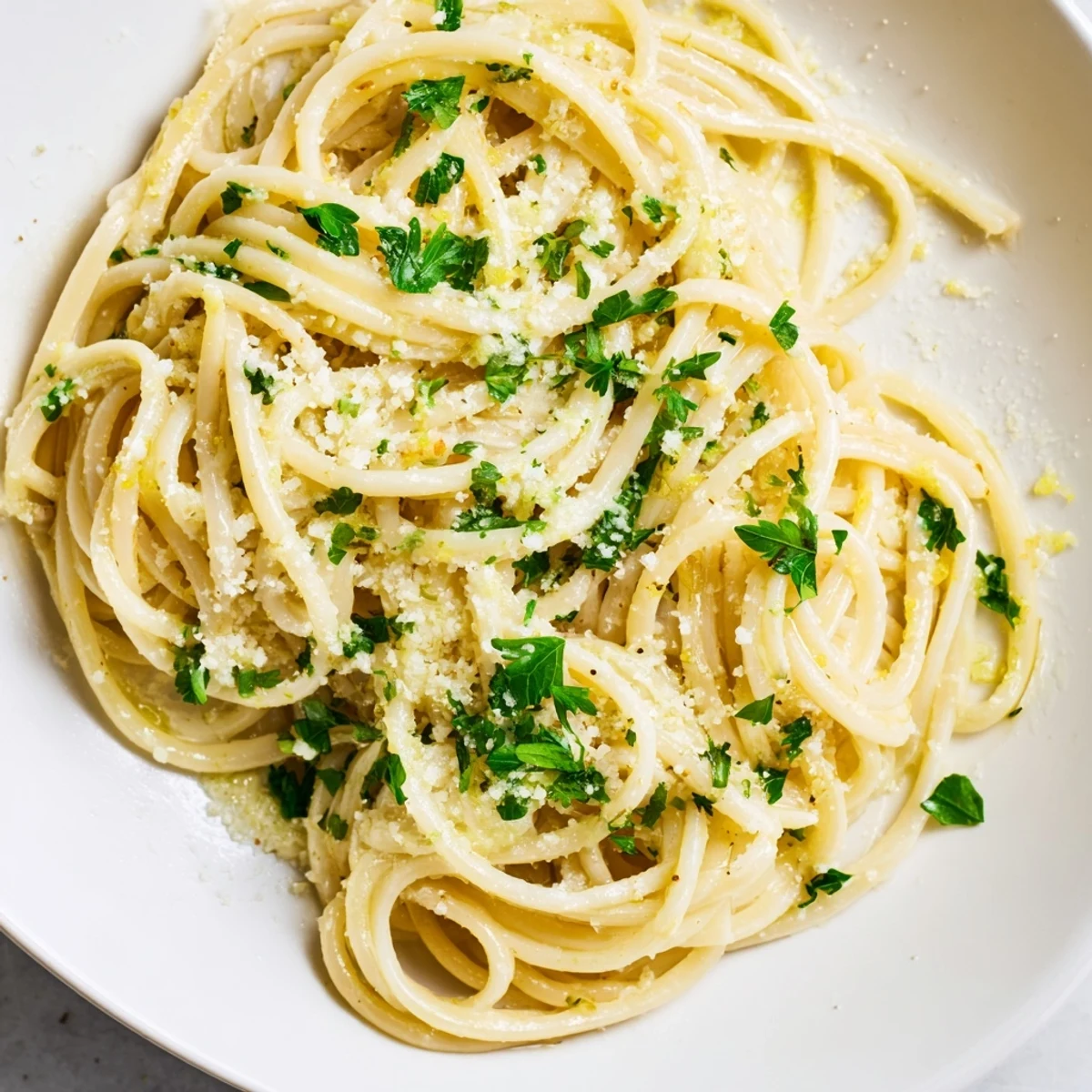 Golden Garlic Butter Linguine, glistening and plated with fresh parsley, ready to savor.