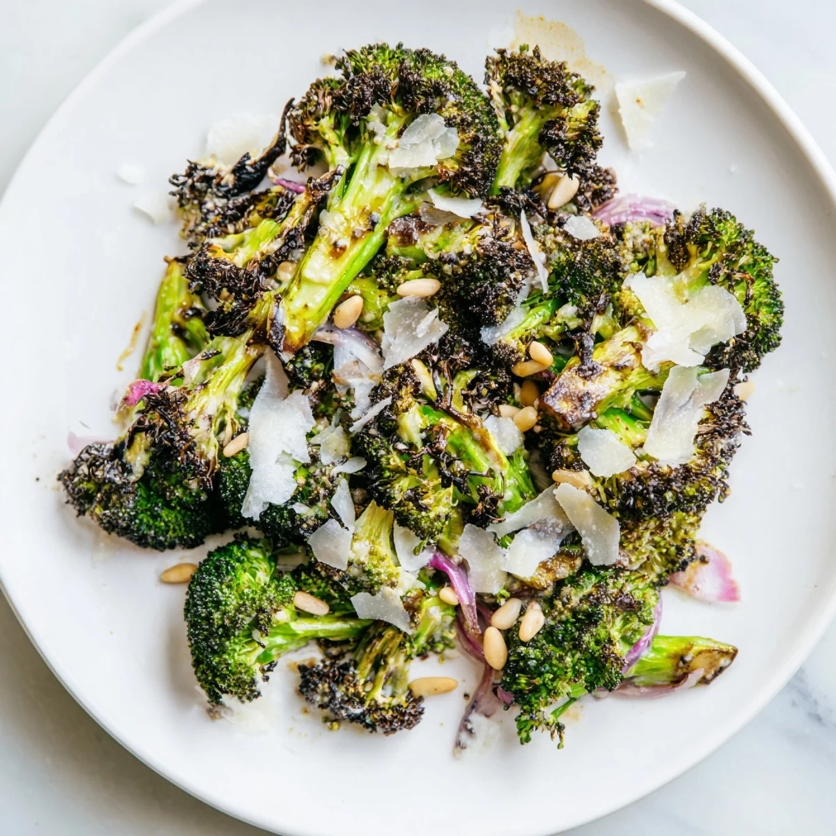 Beautifully charred broccoli salad with red onion, a perfect vegetarian side or light meal.