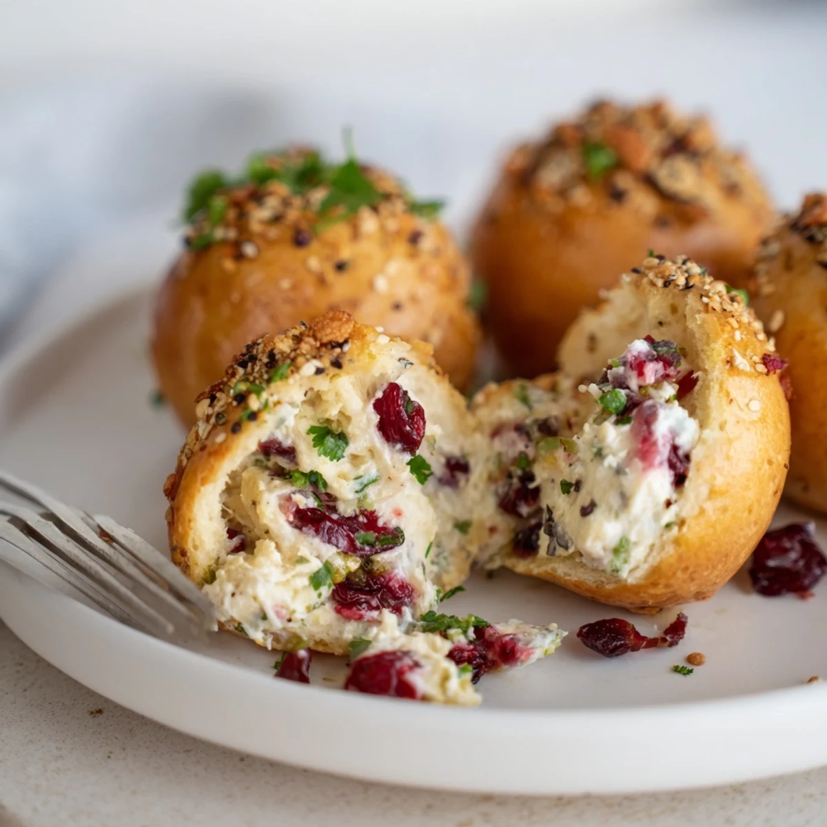 Soft cranberry jalapeño dip bagel bombs, golden and perfect for festive appetizers.  