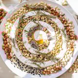 The Labyrinth: a beautifully arranged grazing platter of seeds and nuts surrounding a soft cheese wheel.
