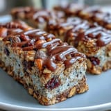 No-Bake Granola Energy Bars with oats, nuts, and dried fruit on a wooden board, ready for snacking or hiking.