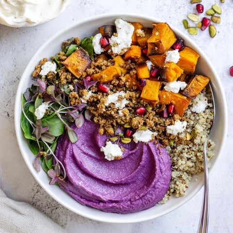 A colorful Spiced Winter Bowl with roasted veggies and ube-coconut purée.  