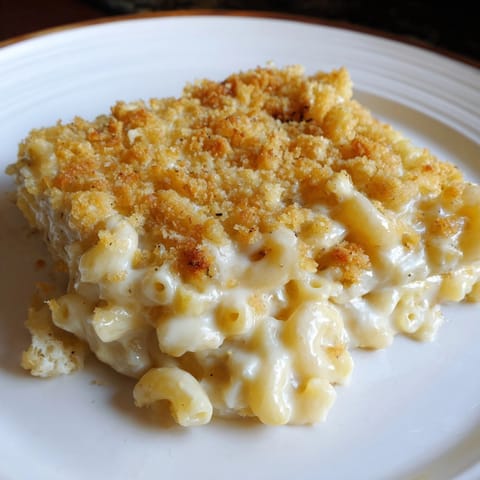 Homemade Mac &amp; Cheese recipe: imagine rich cheddar melting over tender elbow pasta.