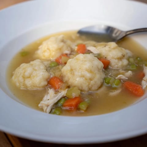 Homemade Chicken and Dumplings recipe: A flavorful, hearty stew perfect for a chilly evening.