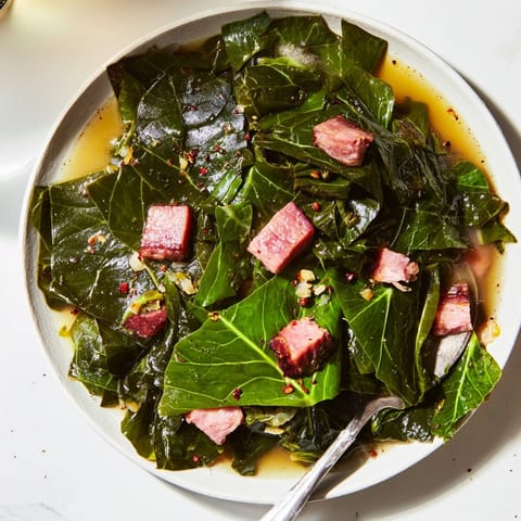 Tender, flavorful Southern Collard Greens recipe, glistening with pot liquor, ready to savor.