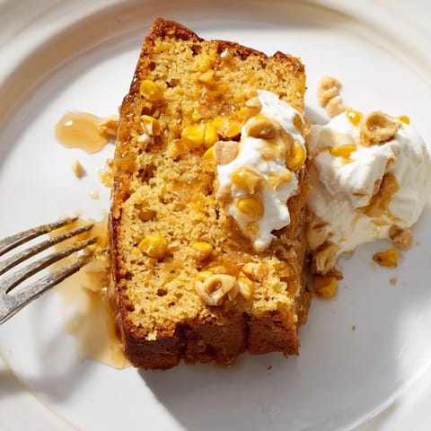 A delicious Maple Bourbon Sweet Corn Pancake Loaf with golden corn kernels and syrupy glaze.  