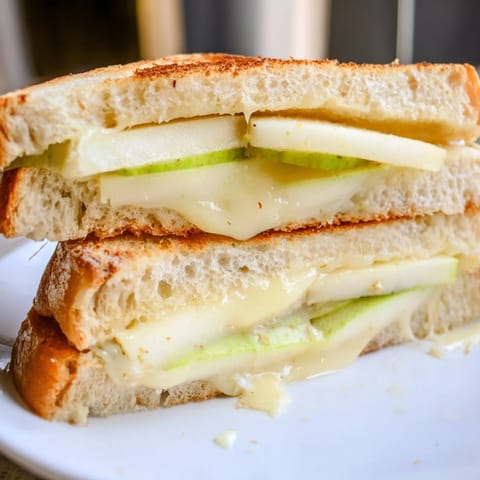 Melted Brie and apple slices create a delicious Brie and Apple Grilled Cheese sandwich.