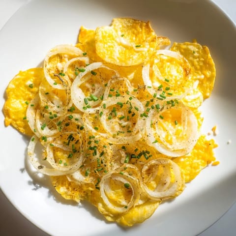 Air-fried crispy onion cheese chips with melted cheddar and mozzarella, perfect for a party appetizer.